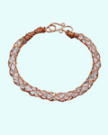  Handmade copper kumihimo bracelet with rose quartz beads visible through the hollow braid, by 8th by MOC Designs
